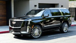 Black luxury SUV parked in driveway